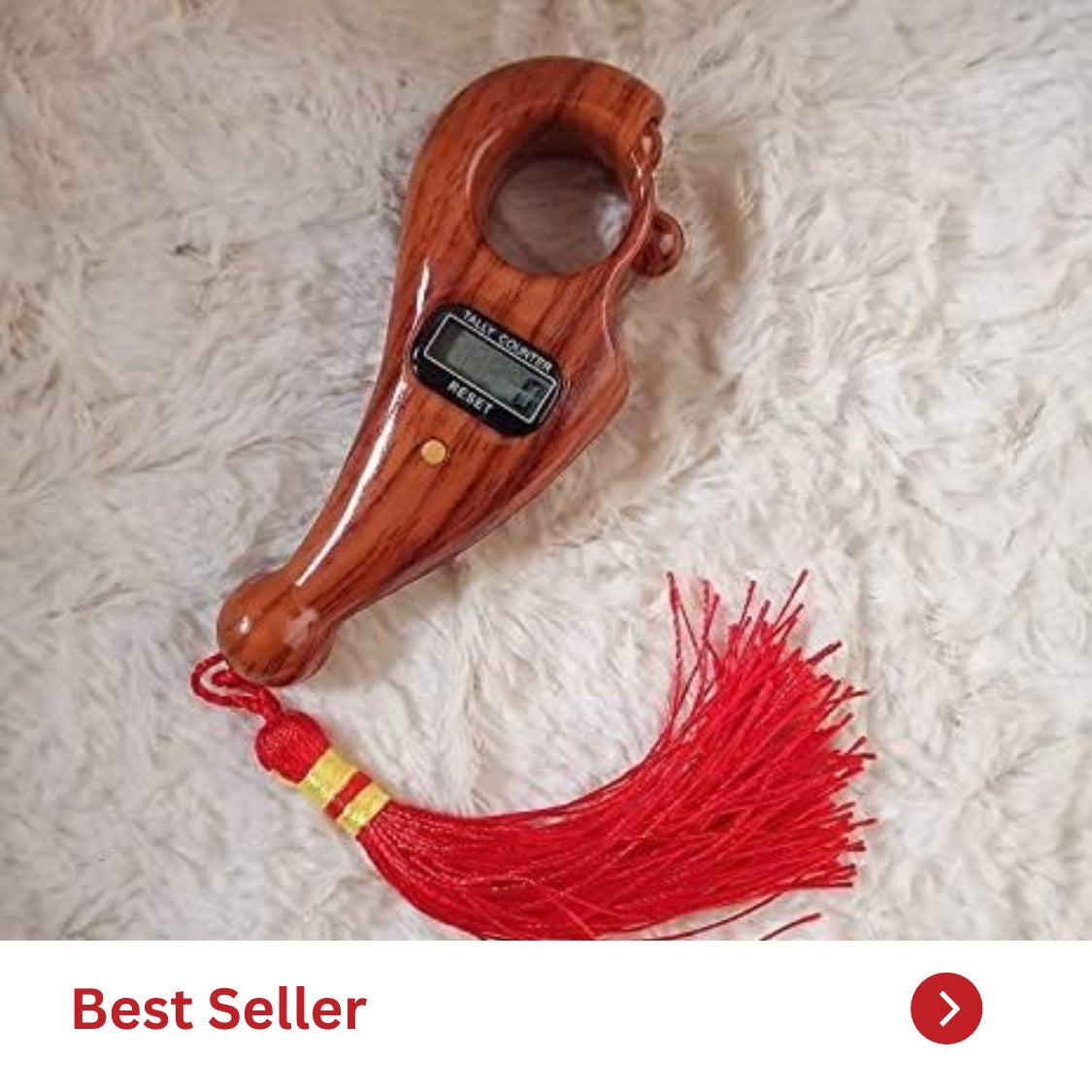 Best seller wooden hand-held item with a digital display and red tassel against a soft background.