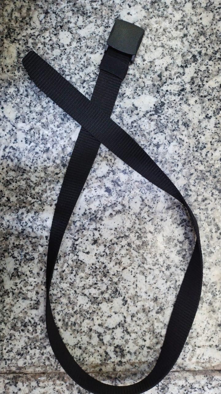 Unisex black canvas belt laid out on a granite surface, showcasing its adjustable design and durable buckle.